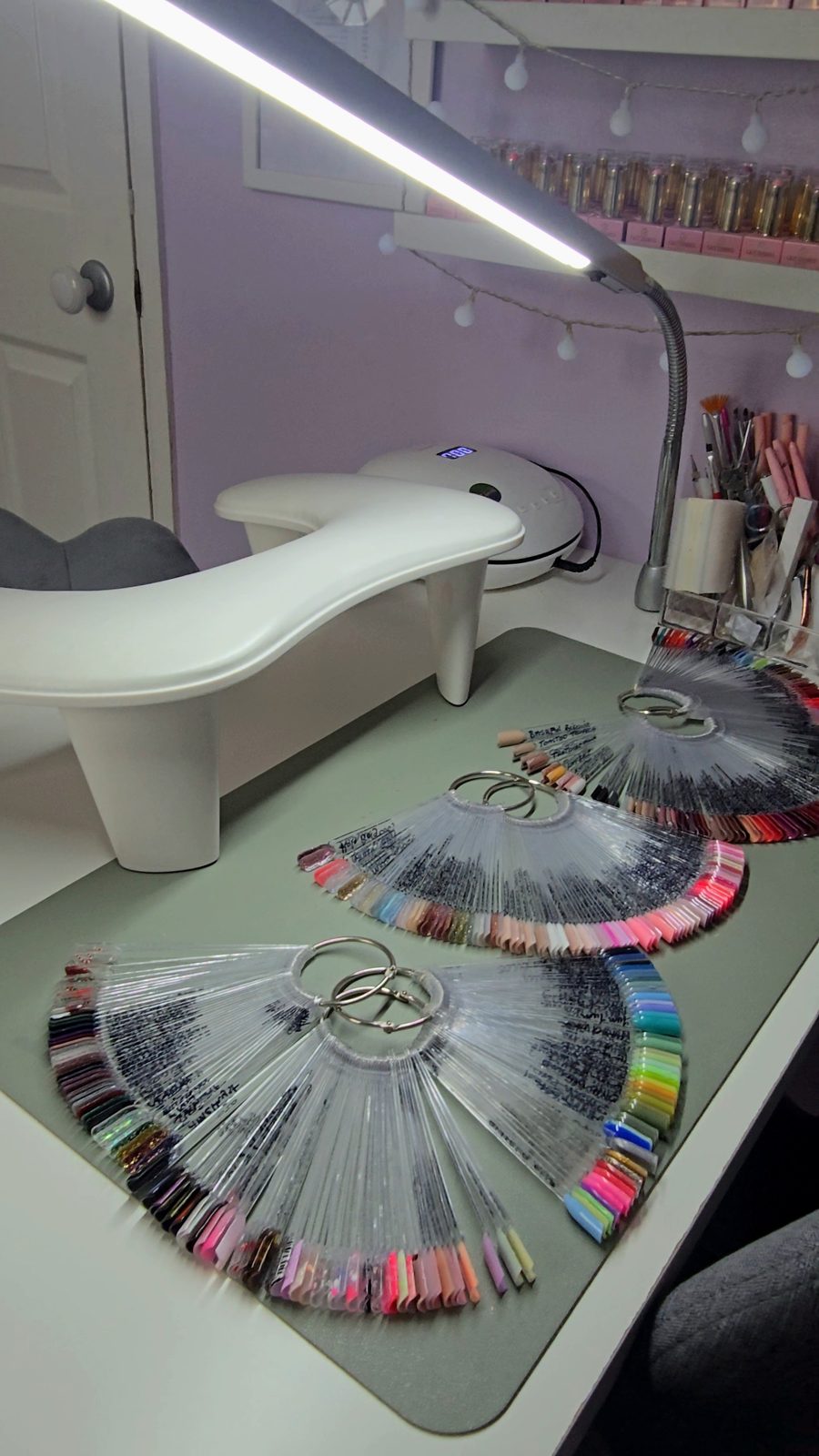 Gel colour swatch wheels on the nail desk